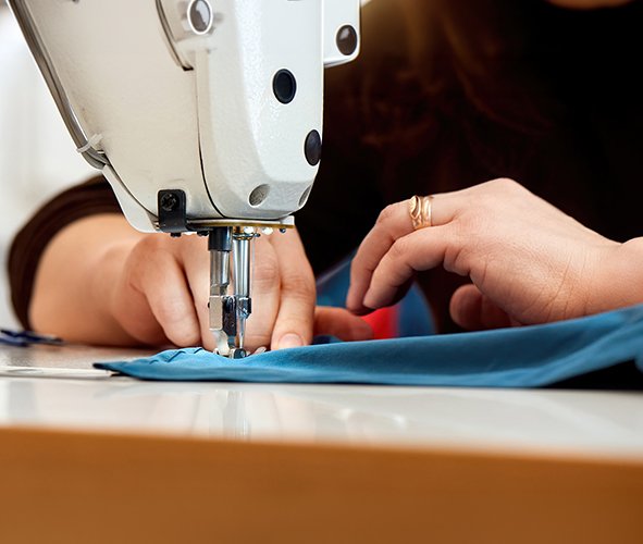 woman working on a sewing machine